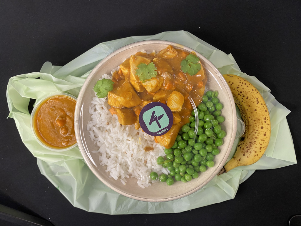 kookaa meal with rice, peas,and chicken. 